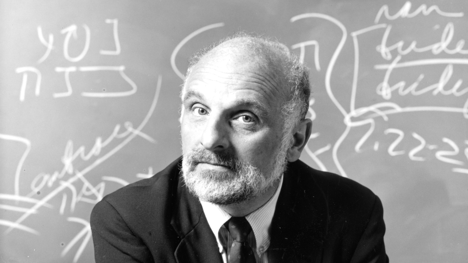 An image of Walter Brueggemann in front of a chalkboard.