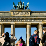Young people in front of the Brandenburg Gate in Berlin