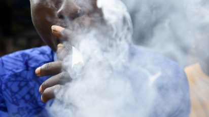 A man smokes marijuana in Lagos, Nigeria.