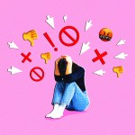 A person shielding her head from angry emojis.