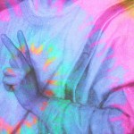 Jesus making a 'peace' sign with his fingers.