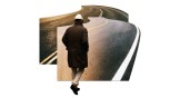 A Black man walking down a path