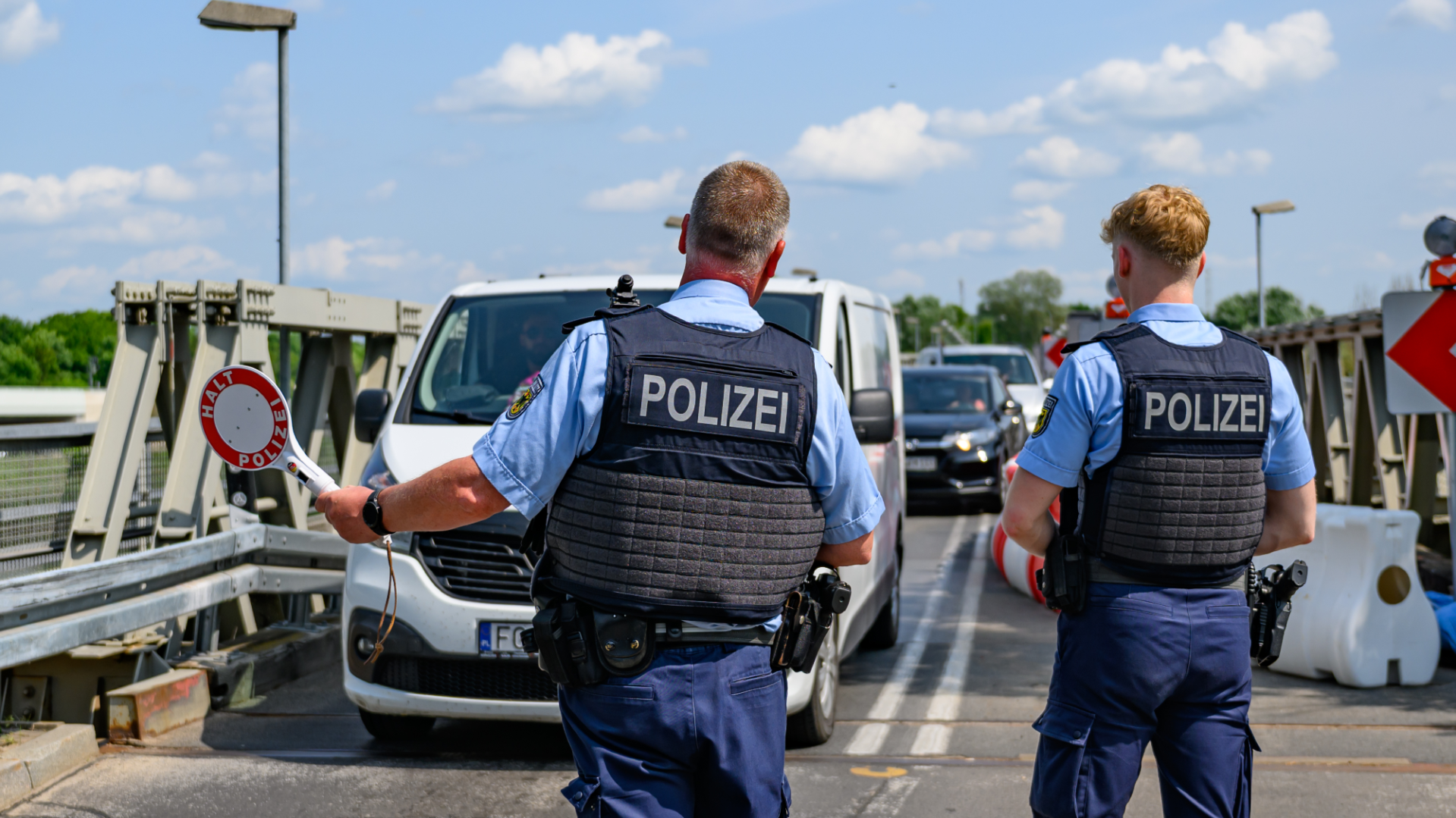 German police check cars for immigrants at the border