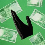 Hand raised with Nigerian currency behind it