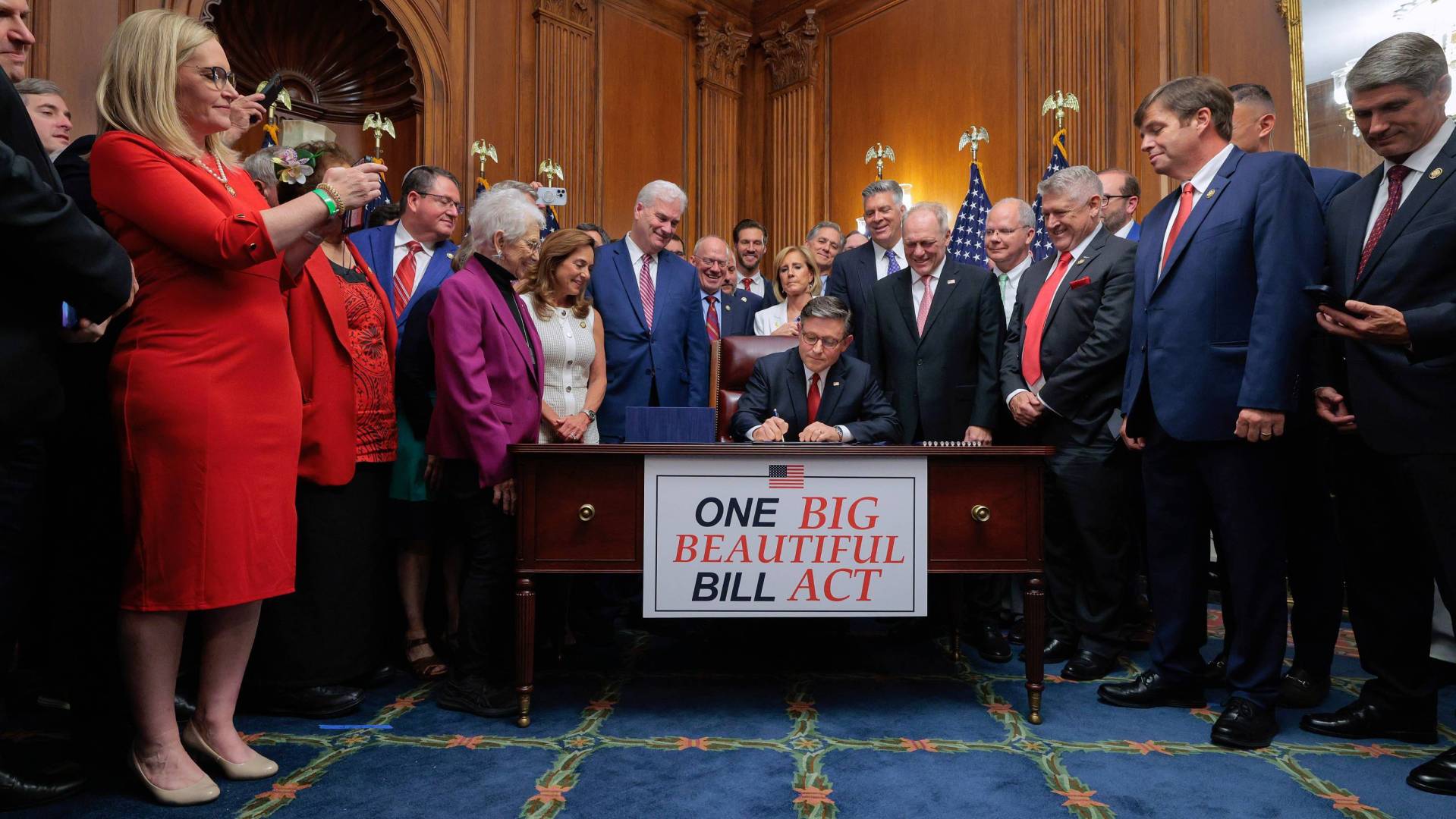 House Speaker Mike Johnson signs the one big beautiful bill act.