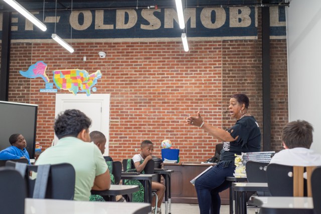 Edna Williams talks with students about their futures before taking their final exam.