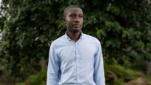 Portrait of Emmanuel Nwachukwe on a foliage background