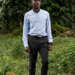 Portrait of Emmanuel Nwachukwe on a foliage background