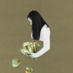 A woman with a rose and petals