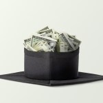 A graduation cap full of money.