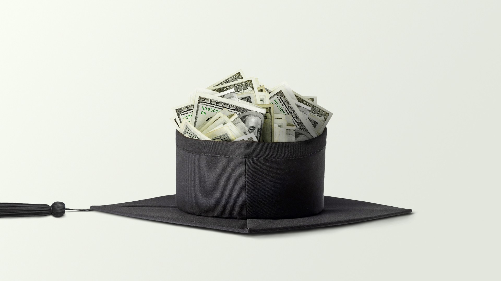 A graduation cap full of money.
