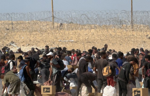 Palestinians in Gaza getting food from the GHF site.