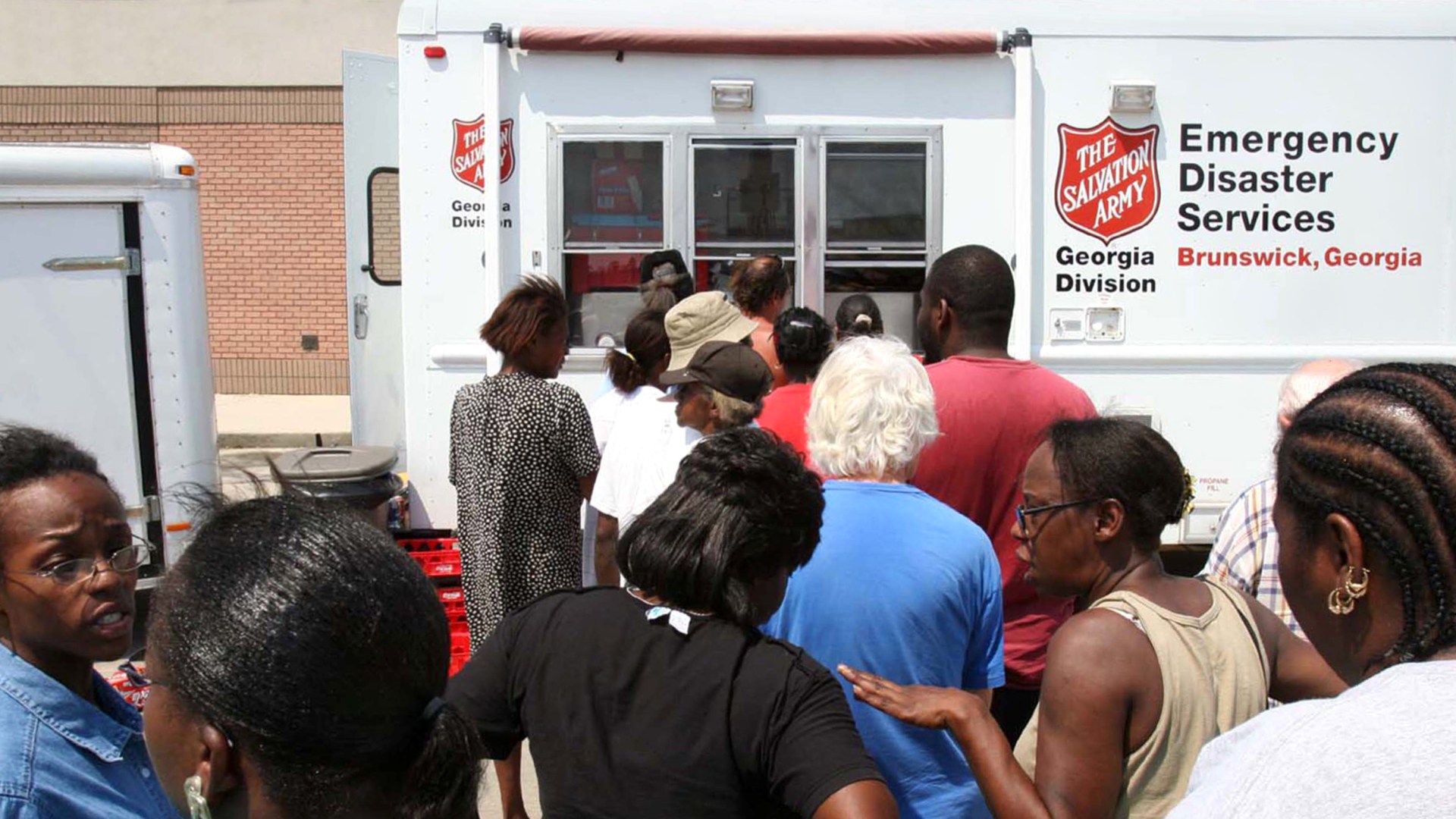 People in line to get help from a Salvation Army truck.