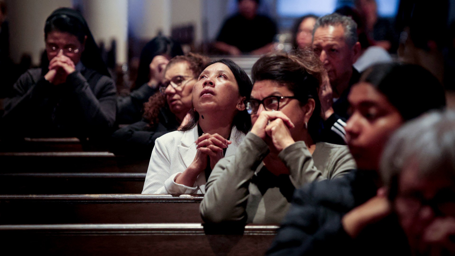 Worshipers attend a church service marking World Refugee Day.