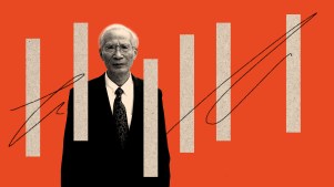 David Lin standing behind bars