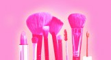 Glowing makeup brushes and lipstick.