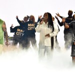 From left to right: Brandon Lake, Naomi Raine, and Chandler Moore of Maverick City Music perform onstage in Los Angeles, California.