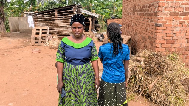 Nante Sulinah stands next to her daughter, N. S., age 12.