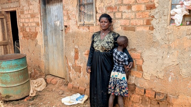 Nantumbwe Rose stands next to her daughter, N. T., age 11.