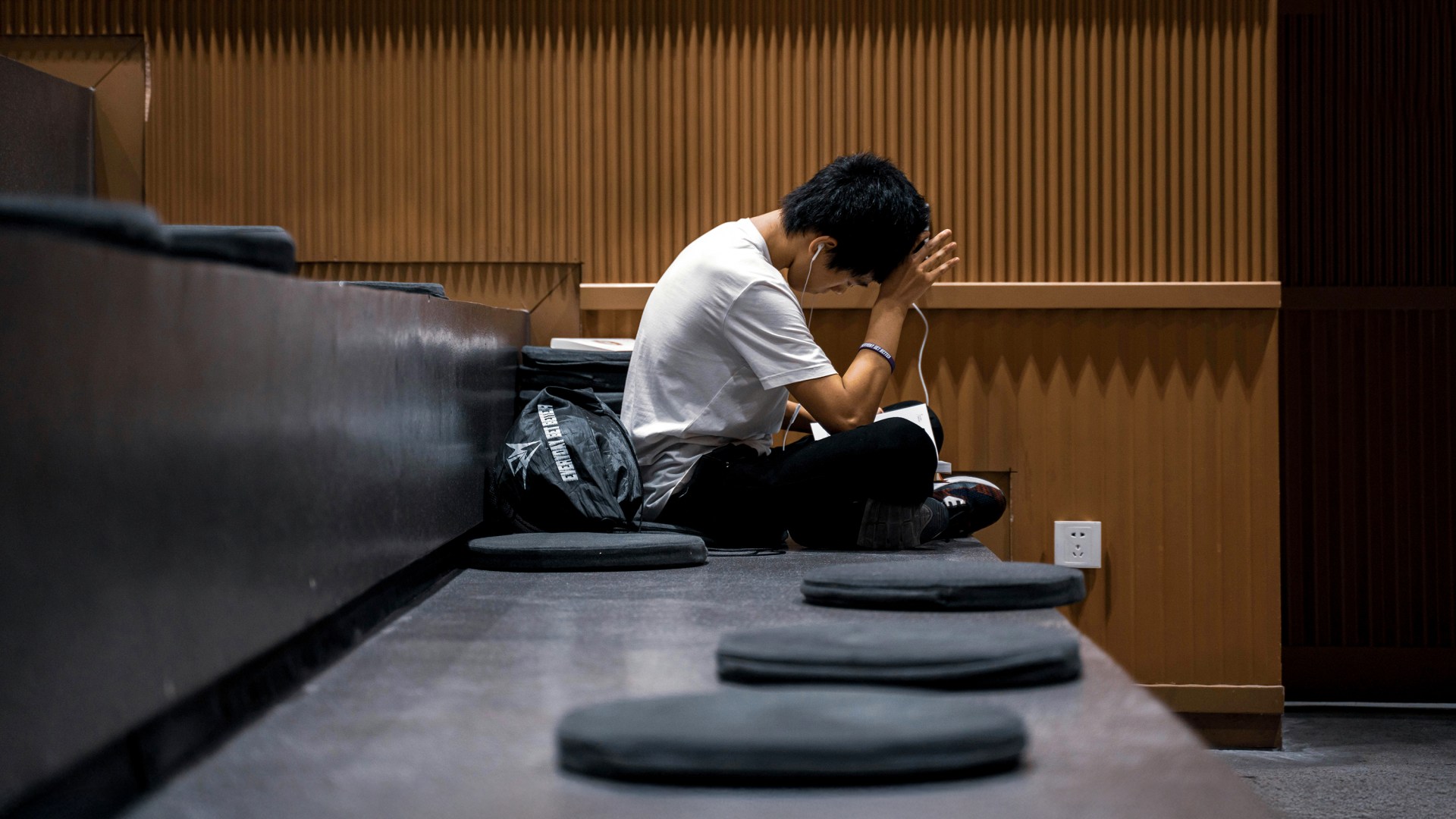 A Chinese student sitting and studying in a classroom