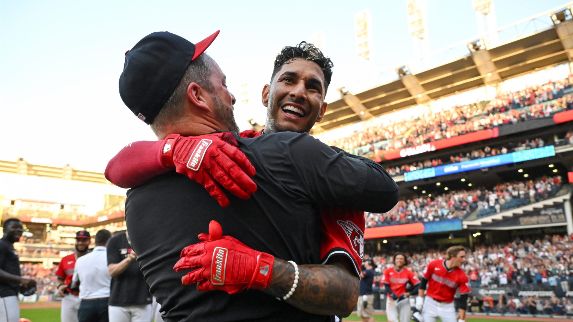Brayan Rocchio #4 and manager Stephen Vogt #12 of the Cleveland Guardians celebrates Rocchio's walk off three-run home run to defeat the Texas Rangers 9-8 in ten innings.