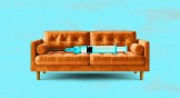 A syringe laying on a couch.