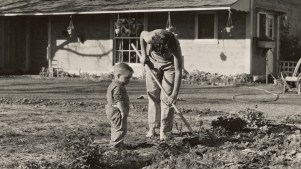 A mom and son gardening.