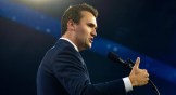 Charlie Kirk speaking at an event.