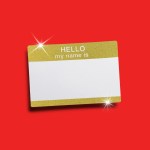 A sparkling gold name tag