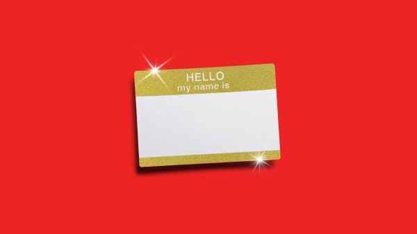 A sparkling gold name tag