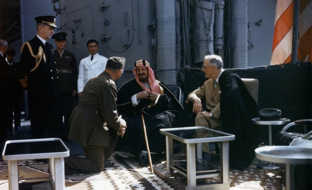 Bill serving as translator between King Abdul-Aziz Al Saud and President Franklin Roosevelt.