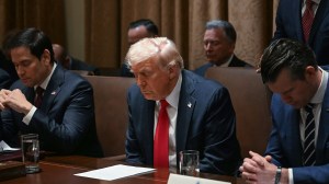 US President Donald Trump bows his head in prayer during a cabinet meeting at the White House in Washington, DC, on February 26, 2025. Also pictured, L-R, Secretary of State Marco Rubio, Secretary of Defense Pete Hegseth and House and Urban Development Secretary Scott Turner.