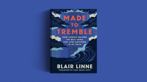 The book cover on a purple background.