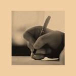 A hand writing on an orange background.