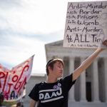 Pro-life sign held before court