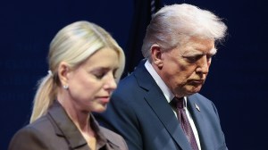 President Donald Trump bows his head in prayer with Attorney General Pam Bondi at the Museum of the Bible on Sept. 8.