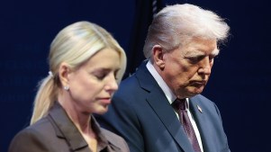 President Donald Trump bows his head in prayer with Attorney General Pam Bondi at the Museum of the Bible on Sept. 8.
