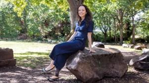 Photo of Stef Reid sitting on a rock