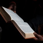 Bible reading at home in a village near Gicumbi, northern province, Rwanda. (photo by: Godong/ Universal Images Group via Getty Images)