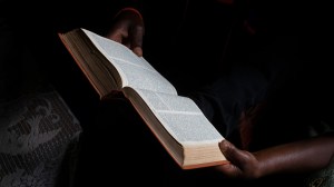 Bible reading at home in a village near Gicumbi, northern province, Rwanda. (photo by: Godong/ Universal Images Group via Getty Images)