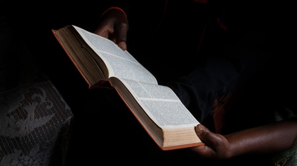 Bible reading at home in a village near Gicumbi, northern province, Rwanda. (photo by: Godong/ Universal Images Group via Getty Images)