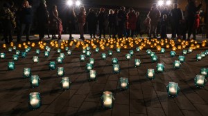 People at a 'Light for Ukraine' vigil in Poland in February 2023.