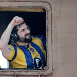 Ziv Berman, one of the released Israeli hostages formerly held captive in Gaza since 2023, gestures from the window of an Israeli helicopter.
