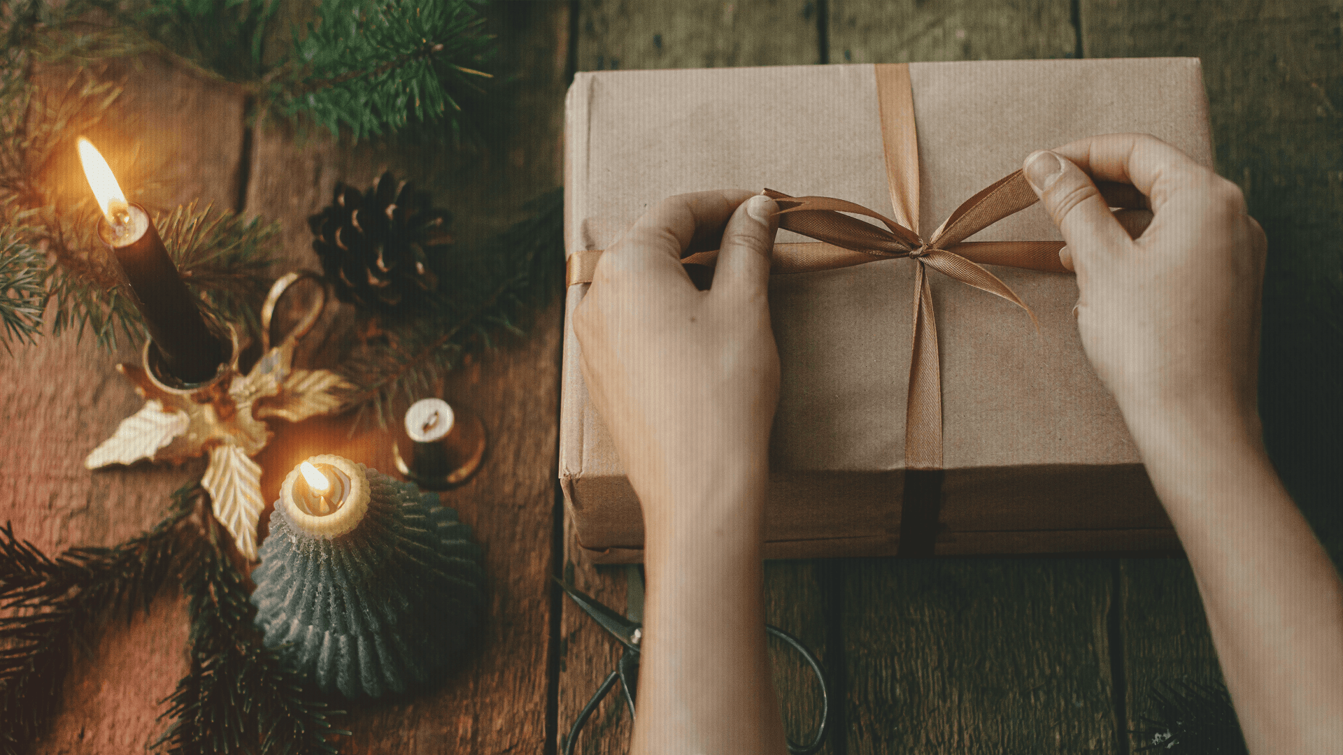Woman wrapping a gift for the Christmas season