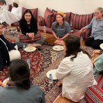 American Christians and local Muslims eating lunch together in Oman.