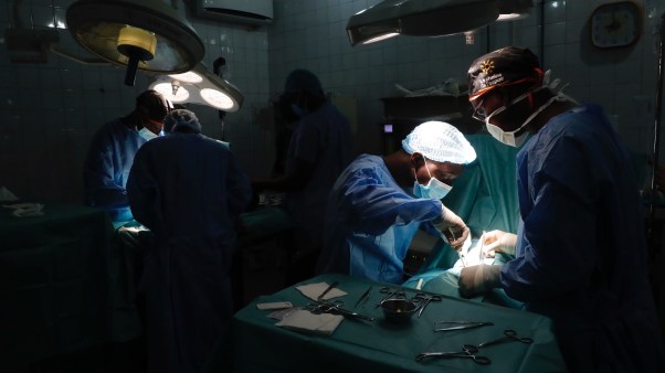 Surgeons operate in a pediatric ward in Benin.