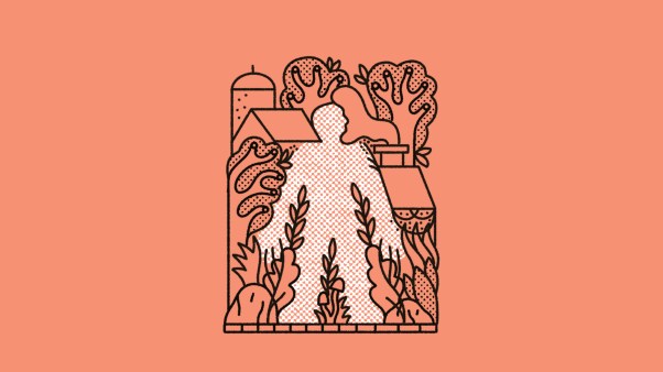 A man fully embraced by nature, houses, and churches.