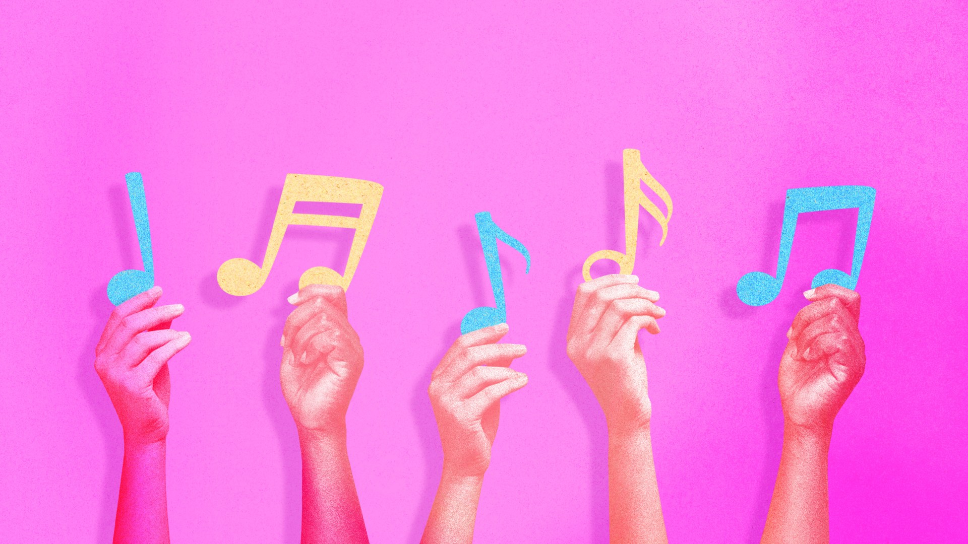 Hands holding up music notes.