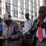 People praying in church.