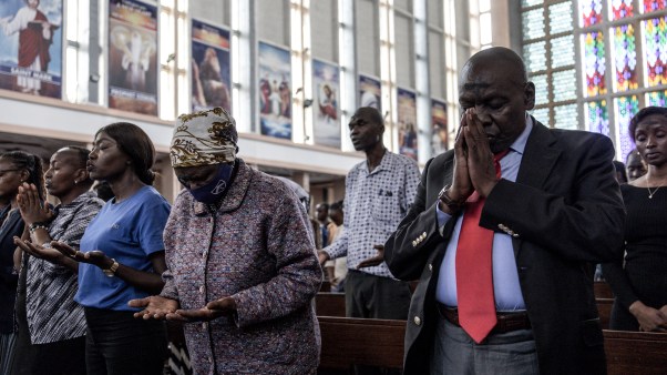 People praying in church.